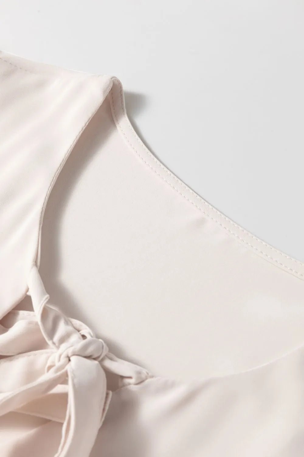 Bow Tie Short Puff Sleeve Ruffle Hem Blouse – Eggshell for Shopify Collective (6 view)