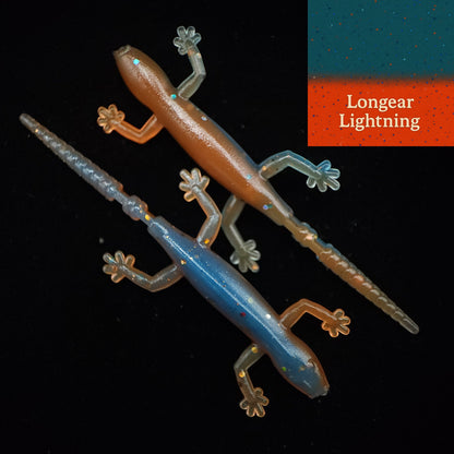 Two fishing lures shaped like lizards on a black background with 'Longear Lightning' branding.