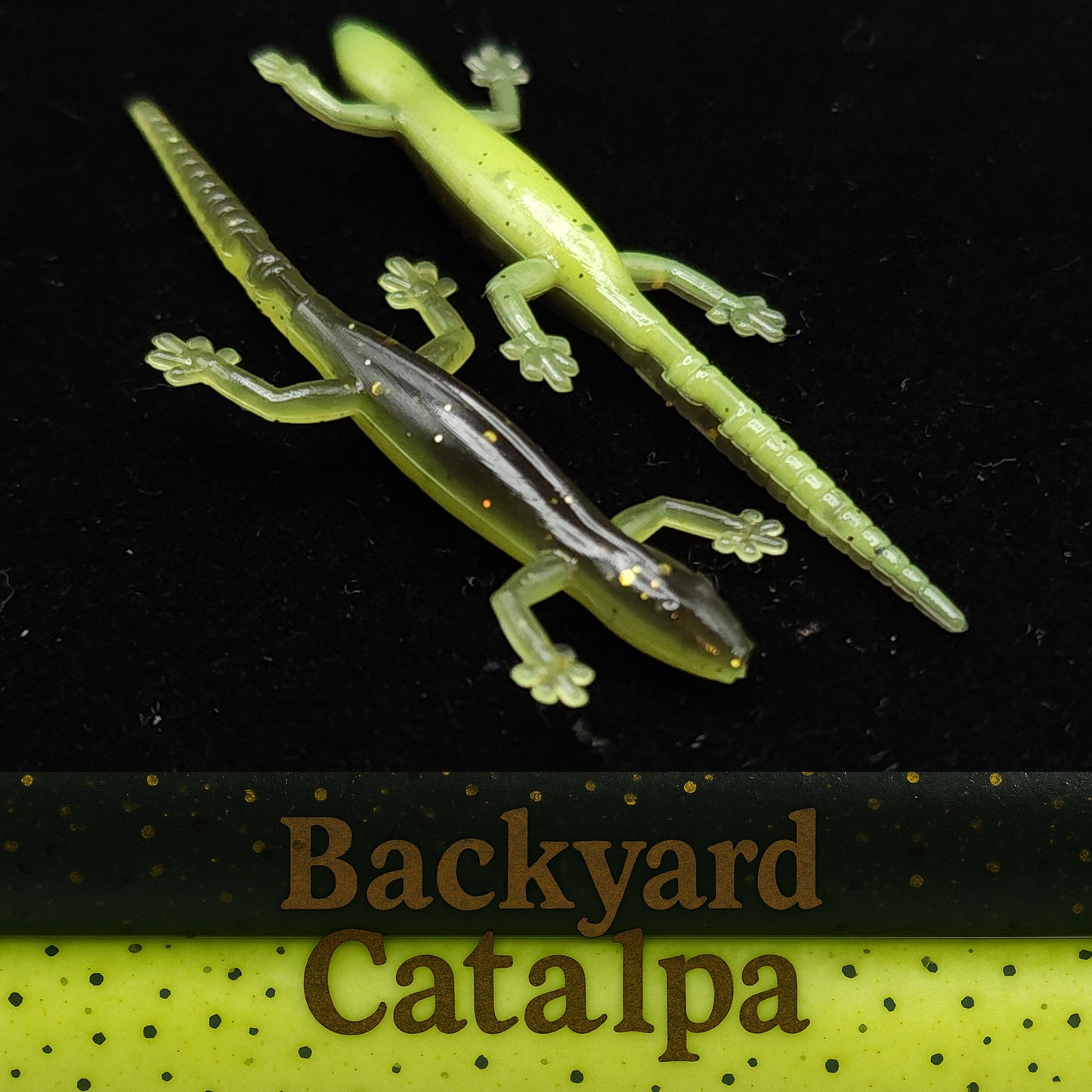 Two green lizard-shaped fishing lures on a black background with 'Backyard Catalpa' branding.