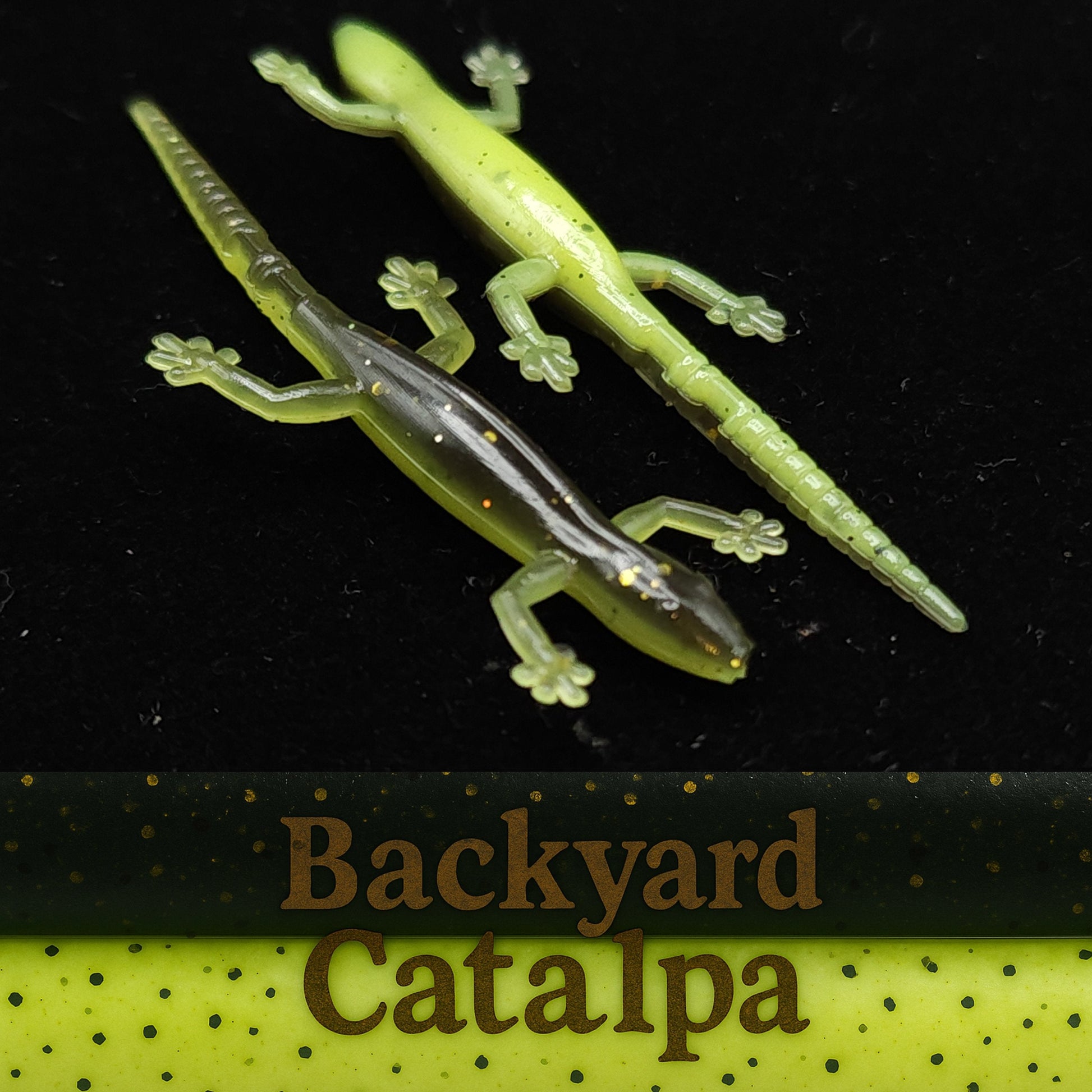 Two green lizard-shaped fishing lures on a black background with 'Backyard Catalpa' branding.