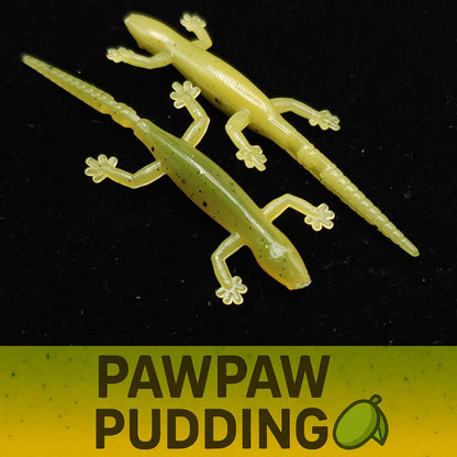 Two green lizard-shaped items on a black background with 'Pawpaw Pudding' text below.
