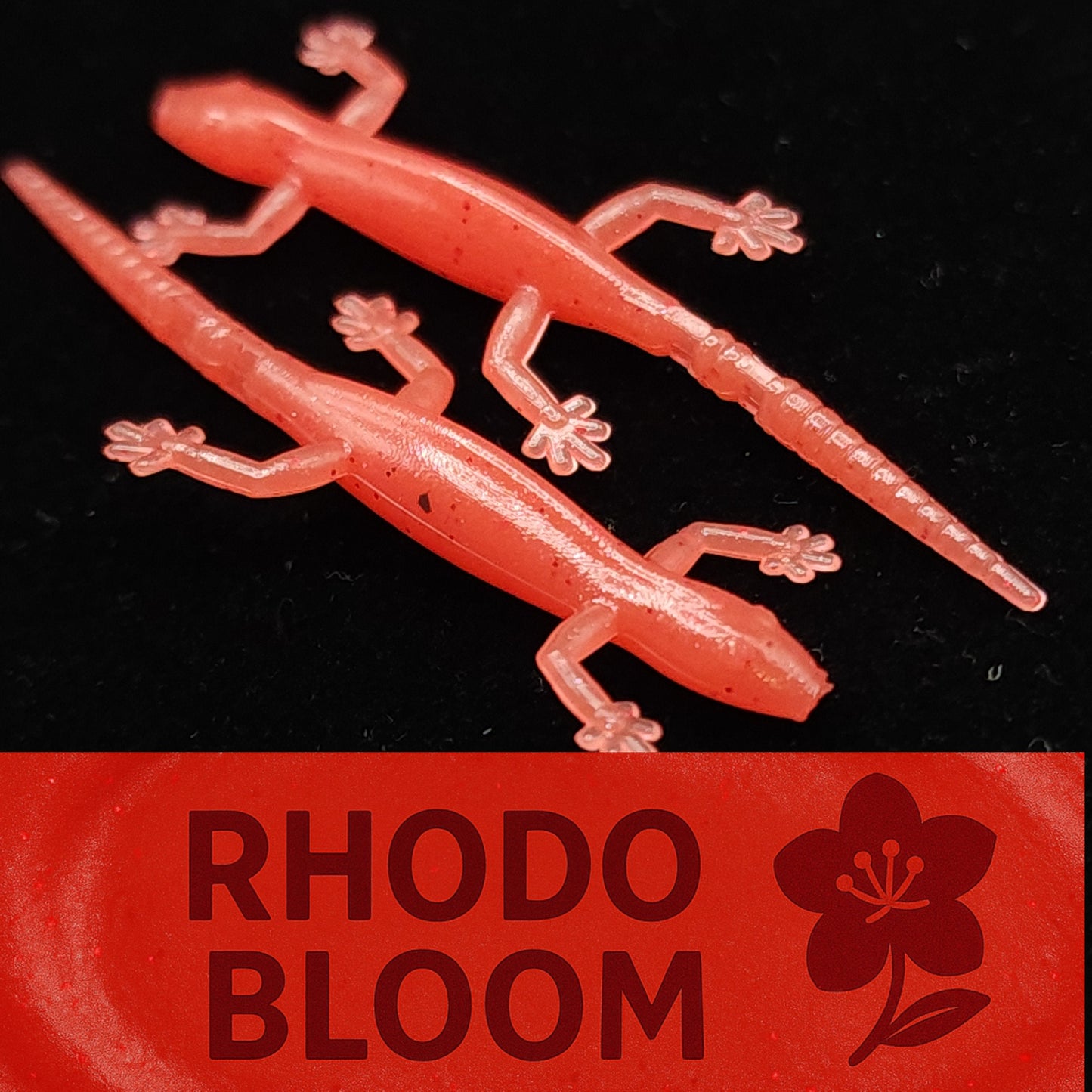 Red gecko-shaped object with 'Rhodo Bloom' branding on a black background