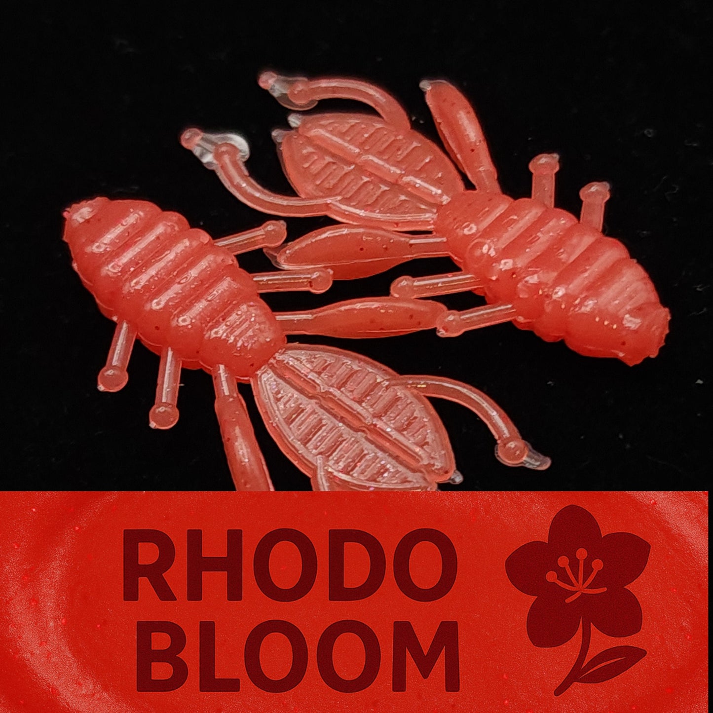 Red plastic bugs with 'Rhodo Bloom' branding on a black background
