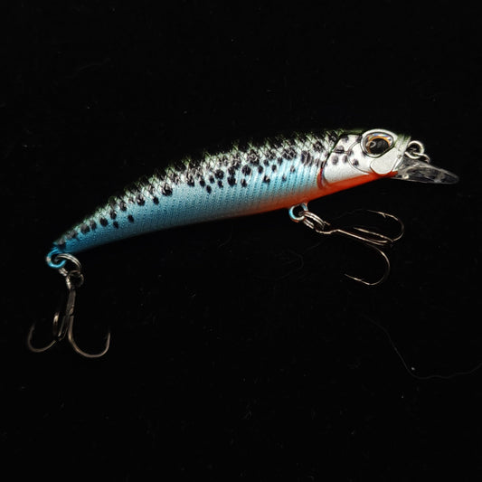 Fishing lure with a black and blue pattern on a black background