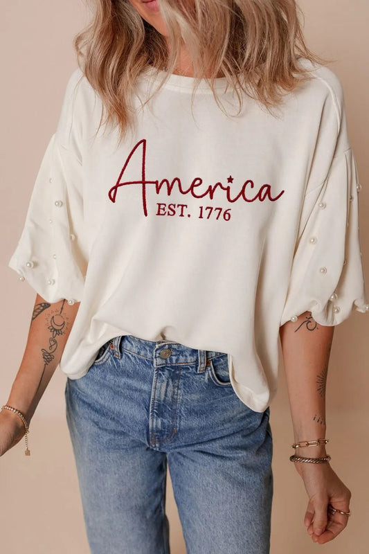 AMERICA EST 1776 Embroidered Pearl Beaded Sleeve T Shirt – White for Shopify Collective (1 view)