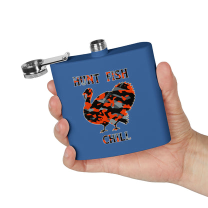 Blue flask with a turkey design and text 'Hunt Fish Chill' held in a hand against a white background