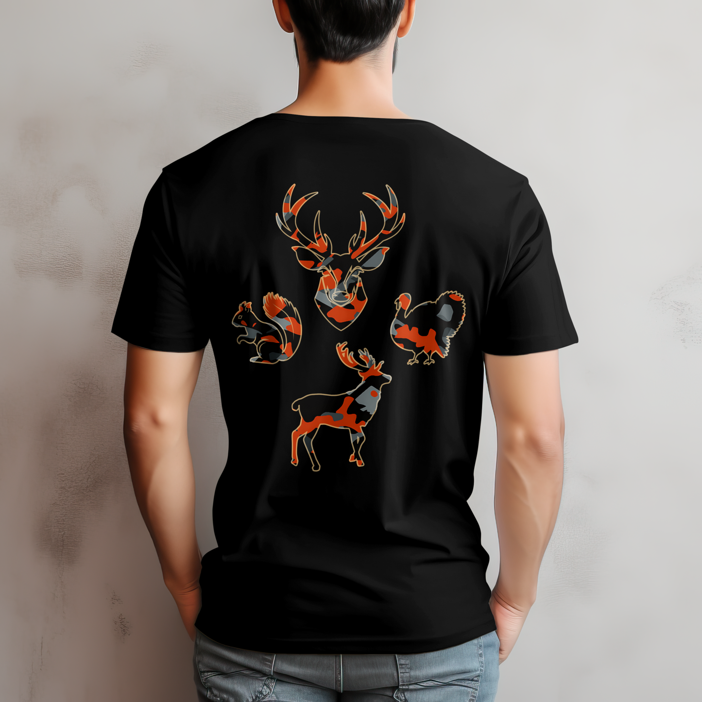 Person wearing a black t-shirt with deer and squirrel designs on the back against a gray background